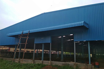 PEB warehouse finished look with Colour Coated Steel Sheets